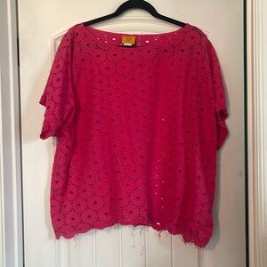 Pink shirt with holes in it.